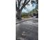 Exterior view of parking spots with a gate and landscape alongside a parking spot at 5162 Puritan Cir # 5162, Tampa, FL 33617