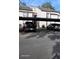 Exterior of covered parking spots with multiple vehicles and a staircase at 5162 Puritan Cir # 5162, Tampa, FL 33617
