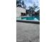 Exterior view of a pool with blue lounge chairs and surrounding landscaping at 5162 Puritan Cir # 5162, Tampa, FL 33617