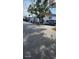 Exterior view of parking in front of a multi-unit complex on a sunny day at 5162 Puritan Cir # 5162, Tampa, FL 33617