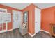 Bright entryway featuring a coat rack, storage bench, and access to both the interior and exterior of the home at 6537 8Th N Ave, St Petersburg, FL 33710