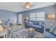 Comfortable living room with tile floors, neutral decor, and plenty of natural light at 6537 8Th N Ave, St Petersburg, FL 33710