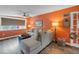 Comfortable living room featuring a sofa, hardwood floors, natural light, and stylish coastal decor at 6537 8Th N Ave, St Petersburg, FL 33710