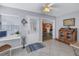 Neutral mud room with white walls, access to the dining and living room, large door, and computer desk at 6537 8Th N Ave, St Petersburg, FL 33710