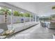 Relaxing screened-in patio with comfortable seating area overlooking backyard and pool at 6537 8Th N Ave, St Petersburg, FL 33710
