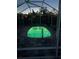 Modern pool in screened enclosure, beautifully illuminated at night at 6537 8Th N Ave, St Petersburg, FL 33710
