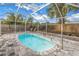 Beautiful screened-in pool with clear blue water surrounded by a spacious brick patio at 6537 8Th N Ave, St Petersburg, FL 33710