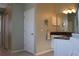 Bathroom featuring double vanity with granite countertop and bright lighting at 6618 Peach Tree Creek Rd, Bradenton, FL 34203