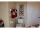 Bathroom featuring a toilet, tiled flooring and a white door at 6618 Peach Tree Creek Rd, Bradenton, FL 34203