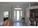 Bright entryway with decorative glass door and tile flooring at 6618 Peach Tree Creek Rd, Bradenton, FL 34203