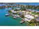 Waterfront property with lush landscaping, private boat dock, and pool offers the ultimate coastal lifestyle at 7984 1St S Ave, St Petersburg, FL 33707