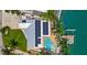 Well-maintained waterfront residence with an in-ground pool, dock, and solar panels, offering sustainable living at 7984 1St S Ave, St Petersburg, FL 33707