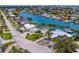 Beautiful waterfront property showcases lush landscaping, a private boat dock, and a refreshing swimming pool at 7984 1St S Ave, St Petersburg, FL 33707