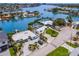 Desirable waterfront property featuring a well-manicured lawn, private boat dock, and an inviting swimming pool at 7984 1St S Ave, St Petersburg, FL 33707