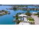 Stunning waterfront home with a private boat dock, sparkling pool, and lush landscaping, ideal for relaxation at 7984 1St S Ave, St Petersburg, FL 33707