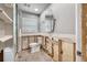 Well-lit bathroom with a shower, toilet, mirror, and a neutral color scheme at 7984 1St S Ave, St Petersburg, FL 33707
