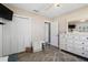 Bedroom featuring neutral tones, wood-look tile floor and closet for ample storage at 7984 1St S Ave, St Petersburg, FL 33707