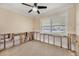 Bright bedroom with a ceiling fan and a large window offering ample natural light at 7984 1St S Ave, St Petersburg, FL 33707