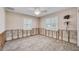 Bright bedroom with new floors, natural light from windows, and fan at 7984 1St S Ave, St Petersburg, FL 33707