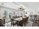 Elegant dining room features a large wood table and windows with waterfront views at 7984 1St S Ave, St Petersburg, FL 33707