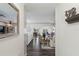 Bright hallway leading to water view, dining room, living room, with views from the front entry at 7984 1St S Ave, St Petersburg, FL 33707