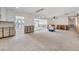 Open-concept living space showcasing unfinished walls, recessed lighting, and views of the waterfront at 7984 1St S Ave, St Petersburg, FL 33707