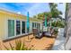 Outdoor seating area with palm trees and a view of the house at 7984 1St S Ave, St Petersburg, FL 33707