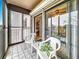 The screened-in balcony features two chairs and a great view of the indoors and the adjacent building at 8174 Terrace Garden N Dr # 307, St Petersburg, FL 33709