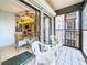 The screened-in balcony offers access to the kitchen and a peaceful view of the outdoors at 8174 Terrace Garden N Dr # 307, St Petersburg, FL 33709