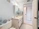 Bathroom featuring a vanity, mirror, toilet, and tile flooring at 8174 Terrace Garden N Dr # 307, St Petersburg, FL 33709