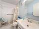 Bathroom featuring a vanity, shower, mirror, toilet and tile flooring at 8174 Terrace Garden N Dr # 307, St Petersburg, FL 33709