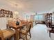 A dining area with wood furniture and decorative plates is adjacent to the living room in this well decorated home at 8174 Terrace Garden N Dr # 307, St Petersburg, FL 33709