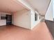 This is a ground level exterior view of the condominium hallway, and exterior door, including the building's architecture at 8174 Terrace Garden N Dr # 307, St Petersburg, FL 33709