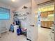 Storage area with a gray filing cabinet along with assorted cleaning and household supplies at 8174 Terrace Garden N Dr # 307, St Petersburg, FL 33709