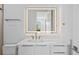 Bright bathroom with a floating vanity, lighted mirror, stylish fixtures, and a minimalist design at 902 W Fribley St, Tampa, FL 33603