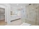 Luxury bathroom with walk-in shower, soaking tub, double sinks, and generous counter space at 902 W Fribley St, Tampa, FL 33603
