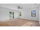 Airy bedroom boasts hardwood floors, large glass doors, and plenty of natural light at 902 W Fribley St, Tampa, FL 33603