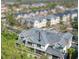A high-angle view of the townhome's roof with a black arrow highlighting the property at 9705 Bay Grove Ln, Tampa, FL 33615