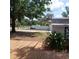 A backyard featuring a storage shed with an exterior view from the deck at 1001 W Baker St, Plant City, FL 33563