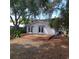 Backyard featuring an oversized wooden deck and a view of the home's exterior at 1001 W Baker St, Plant City, FL 33563