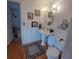 Bright bathroom with pedestal sink, decorative mirror, and toilet at 1001 W Baker St, Plant City, FL 33563