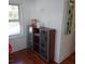 Bedroom featuring a window, modern shelving, and clean decor at 1001 W Baker St, Plant City, FL 33563