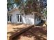 View of the home's backyard with a large deck and double French doors leading into the house at 1001 W Baker St, Plant City, FL 33563