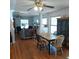 Bright dining room with hardwood floors and a view into the spacious living area at 1001 W Baker St, Plant City, FL 33563