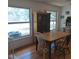 Dining room with natural light, hardwood floors, and classic green hutch at 1001 W Baker St, Plant City, FL 33563