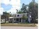 Charming two-story home featuring a welcoming front porch, mature trees, and classic architectural details at 1001 W Baker St, Plant City, FL 33563