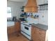 Kitchen boasting a farmhouse sink, modern appliances, and wood cabinetry at 1001 W Baker St, Plant City, FL 33563