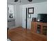 Cozy living room with hardwood floors, built-in shelving, and entertainment center at 1001 W Baker St, Plant City, FL 33563