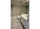 Well-maintained bathroom with tiled shower and updated vanity at 106 Lakeside Ct, Oldsmar, FL 34677