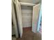 Large walk-in closet with folding doors and shelves, enhancing storage at 106 Lakeside Ct, Oldsmar, FL 34677